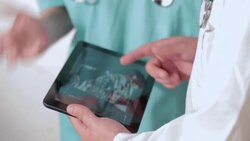 Checking ultrasound on digital tablet Stock Footage