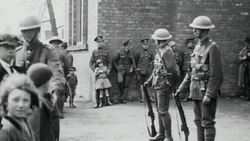 1921 WS London Scottish reservists maintaining a presence on the streets, with one soldier gently pushing back a crowd of children / London, England Stock Footage