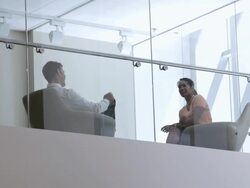  LA Business associates sitting down and talking, seen through interior windows / Seattle, Washington, United States Stock Footage