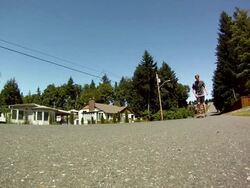 POV of a young man skateboarding down a neighborhood street. - Slow Motion - Model Released - HD Stock Footage