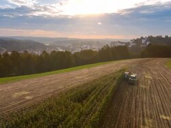 Aerial flight over corn harvest at sunset, Passau, Bavaria, Germany Stock Footage
