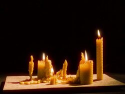 Time-Lapse wax candles burning down to leave wax on a tray. Slight camera move Stock Footage