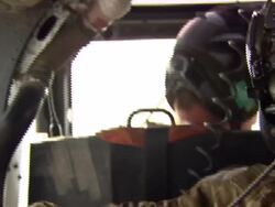 Soldier sitting in Lynx Helicopter Gun Turrett News Clip