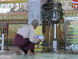 MS Shot of Monk sounding bell inside temple / Yangon, Yangon Division, Myanmar  Stock Footage