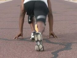 Male running along road Stock Footage