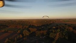 Chasing paragliter Stock Footage