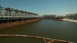 A pumping station is located at a canal entrance. Stock Footage