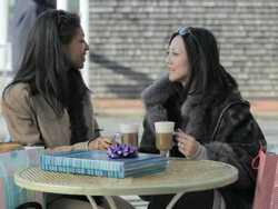 Female friends talking over coffee Stock Footage