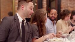MS Man in conversation with friends at table during dinner party Stock Footage