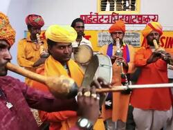 MS PAN Shot of Group of local Indian musicians playing in local market AUDIO / Pushkar, Rajasthan, India  Stock Footage