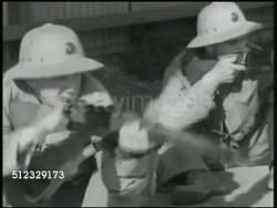 1942: U.S. MARINE CORPS RIFLE RANGE: WS Cadets in line dropping down to sitting position, taking aim, reloading. MS Soldiers reloading. WS Cadets w/ handgun, sidearm taking aim. MS Instructor, cadet firing handgun. MS Soldiers firing handguns. USA Instructional Video