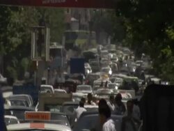 Heat haze enveloping bustling street filled with cars and pedestrians, Tehran, Iran (sound available) Stock Footage