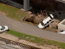 Aerial three cars blown off the highway flyover crashed on Hayne Boulevard / New Orleans, Louisiana Stock Footage