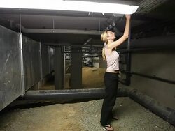 Engineer woman inspecting the underground of a technical plant Stock Footage