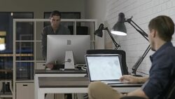 Two young entrepreneur businessmen working late in the office Stock Footage