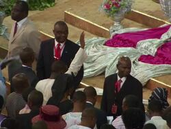 MS Shot of people praying listening to preacher and holding arms up / Lagos, Nigeria Stock Footage