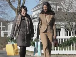 Female friends walking and talking Stock Footage
