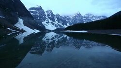 Track shot of Moraine Lake in early summer, Banff NP Stock Footage