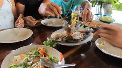 Eating fried Fish Stock Footage