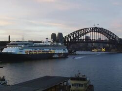 The Ocean Liner "Amsterdam" at the Ocean Terminal with Harbour Bridge late Afternoon, Sydney, New South Wales, Australia Stock Footage
