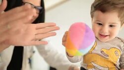 Doctor playing  with a playful little boy at the hospital Stock Footage