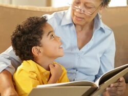 Grandmother and grandson reading a book Stock Footage