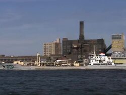 A Barge Passes Under the Williamsburg Bridge Stock Footage