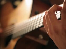 Acoustic guitar in musician hands Stock Footage
