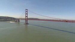 Traffic crosses Golden Gate Bridge over San Francisco Bay. Stock Footage