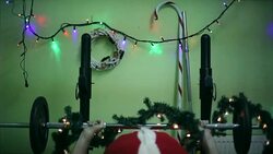 Santa Claus lifts weights at the gym, chrismtas decoration, lights, joke, funny Stock Footage