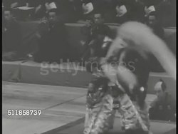 1930s: TOKYO, JAPAN: CULTURAL EVENT: MS Kabuki traditional theater actor in costume as the White Lion in 'Renjishi', vigorous mane-tossing, musicians playing BG. (dark contrast, live performance) Instructional Video