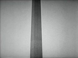 B/W 1932 tilt down from top of Washington Monument to WWI veterans walking in Bonus March Stock Footage
