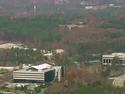 WS AERIAL View of Office building surrounded by trees / North Carolina, United States Stock Footage