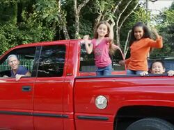 MS Kids having fun on back of red truck / Miami, Florida, United States Stock Footage
