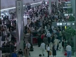 Golden week holiday crowds, departure lounge, Tokyo International Airport, Haneda, Japan Stock Footage