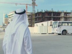 WS ZI Sheik looking at construction site / Dubai, UAE Stock Footage