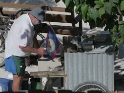 Man barbeques just off the beach in Belize Stock Footage