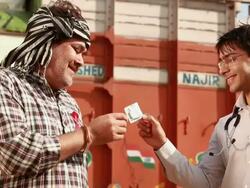 Doctor giving condom to a truck driver, Ballabgarh, Haryana, India Stock Footage