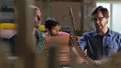 Woodworker shows off flexibility of new chair frame design in studio Stock Footage