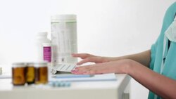 Doctor typing report in doctor's office Stock Footage