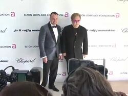 David Furnish, Sir Elton John at the 19th Annual Elton John AIDS Foundation Academy Awards Viewing Party at West Hollywood CA. (Footage by WireImage Video/GettyImages) Stock Footage