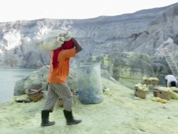 MS PAN TD Miner working at the sulfur extraction on the Ijen volcano next to liquid sulfur / Ijen, Java, Indonesia Stock Footage
