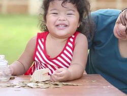 Cute boy with mother learn to count money Stock Footage