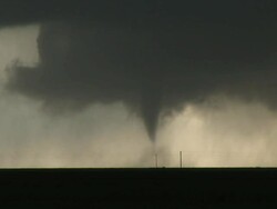WS View of slender cone tornado tracks behind telephone poles near Silverton / Silverton, Texas, United States Stock Footage