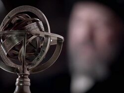A man in period clothing looks toward a armillary sphere. Stock Footage