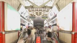 The escalators in the train station crowded with passengers Stock Footage