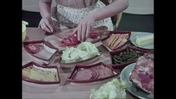 MS Woman chopping and arranging tomatoes / United States Stock Footage