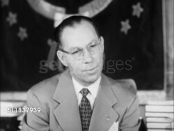 1950: DENVER, COLORADO: GOVERNMENT: 'Executive Chambers' plaque on door. Governor Walter Johnson smoking cigarette in front of banner, SOT Saying aware of people's perspective on Denver, reads 'Life' (magazine) to see world, it brings world to Denver. Instructional Video