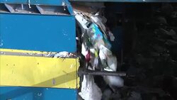 Paper on conveyor belt at recycling plant News Clip