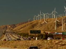 T/L, WS, Traffic on Interstate 10 along hills with wind turbines, Coachella Valley, North Palm Springs, California, USA Stock Footage